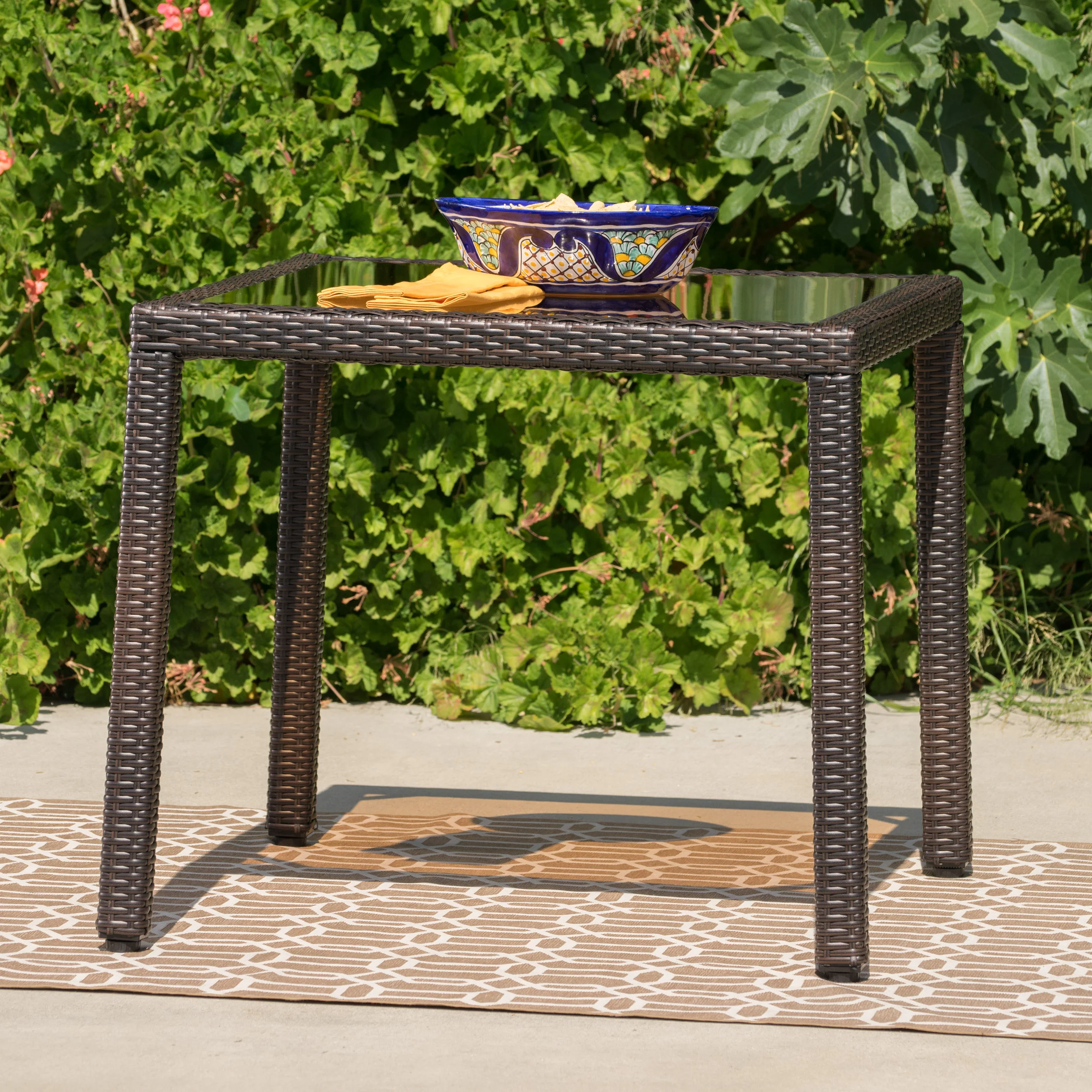 San Tropez Outdoor Wicker Dining Table with Tempered Glass Top - furnishings