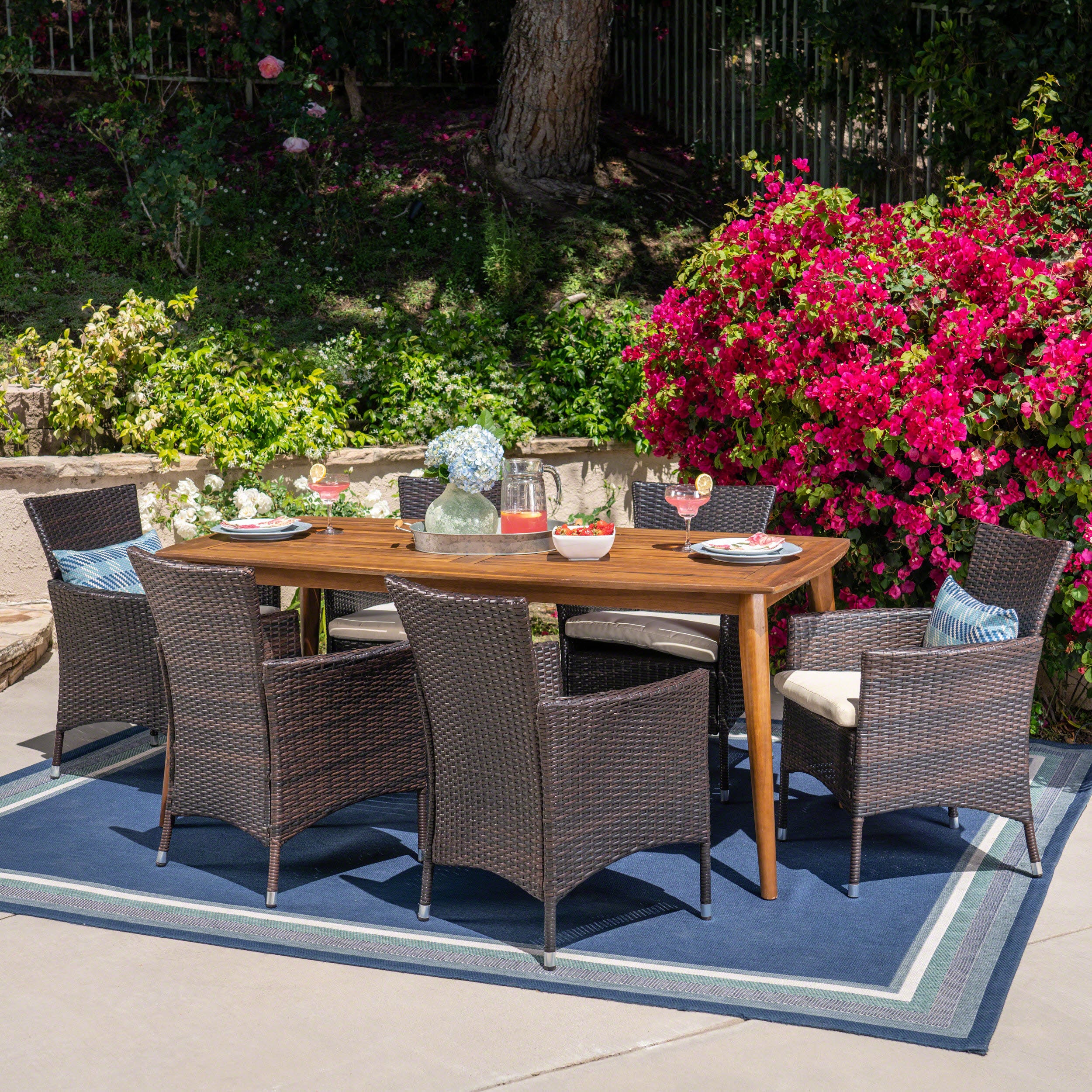 Matthew Outdoor 7 Piece Multibrown Wicker Dining Set with Teak Finish Rectangular Acacia Wood Dining Table and Beige Water Resistant Cushions - furnishings