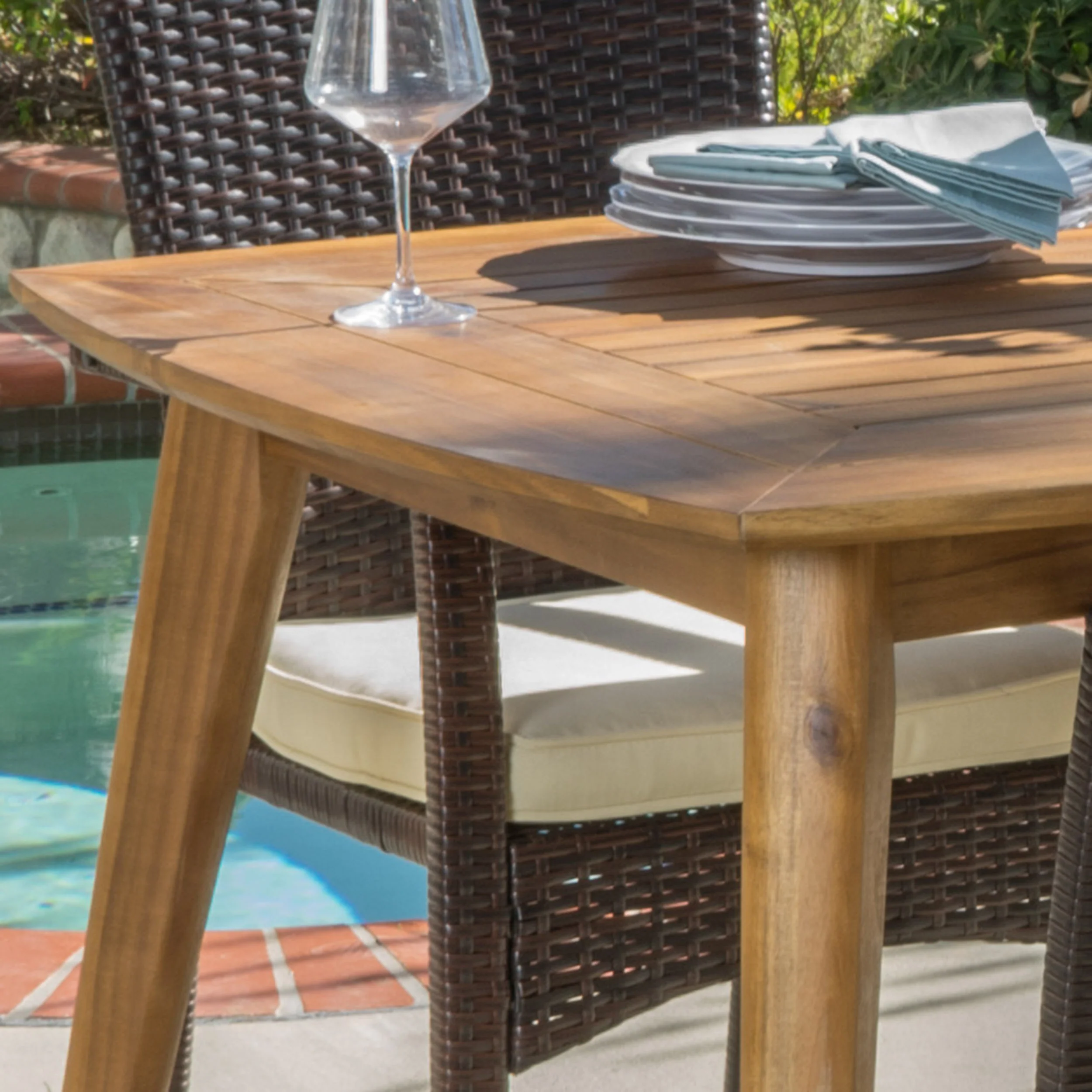 Pisciotta Outdoor 7-Piece Brown Wicker Dining Set with Cream Cushions - furnishings