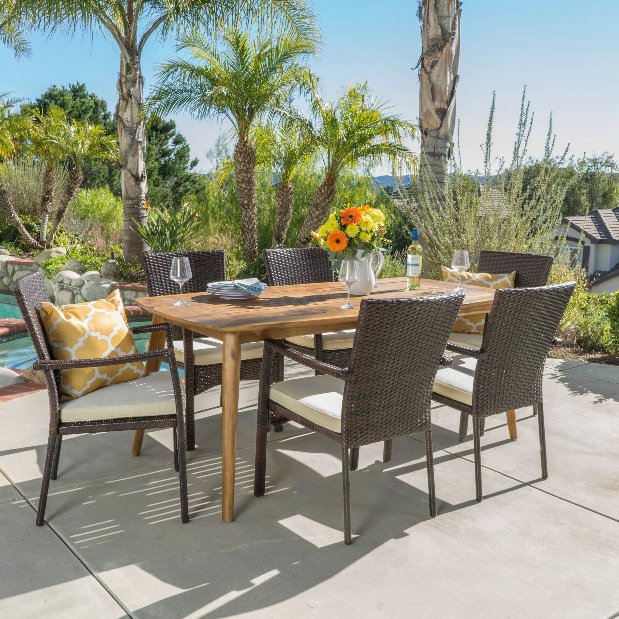 Pisciotta Outdoor 7-Piece Brown Wicker Dining Set with Cream Cushions - furnishings
