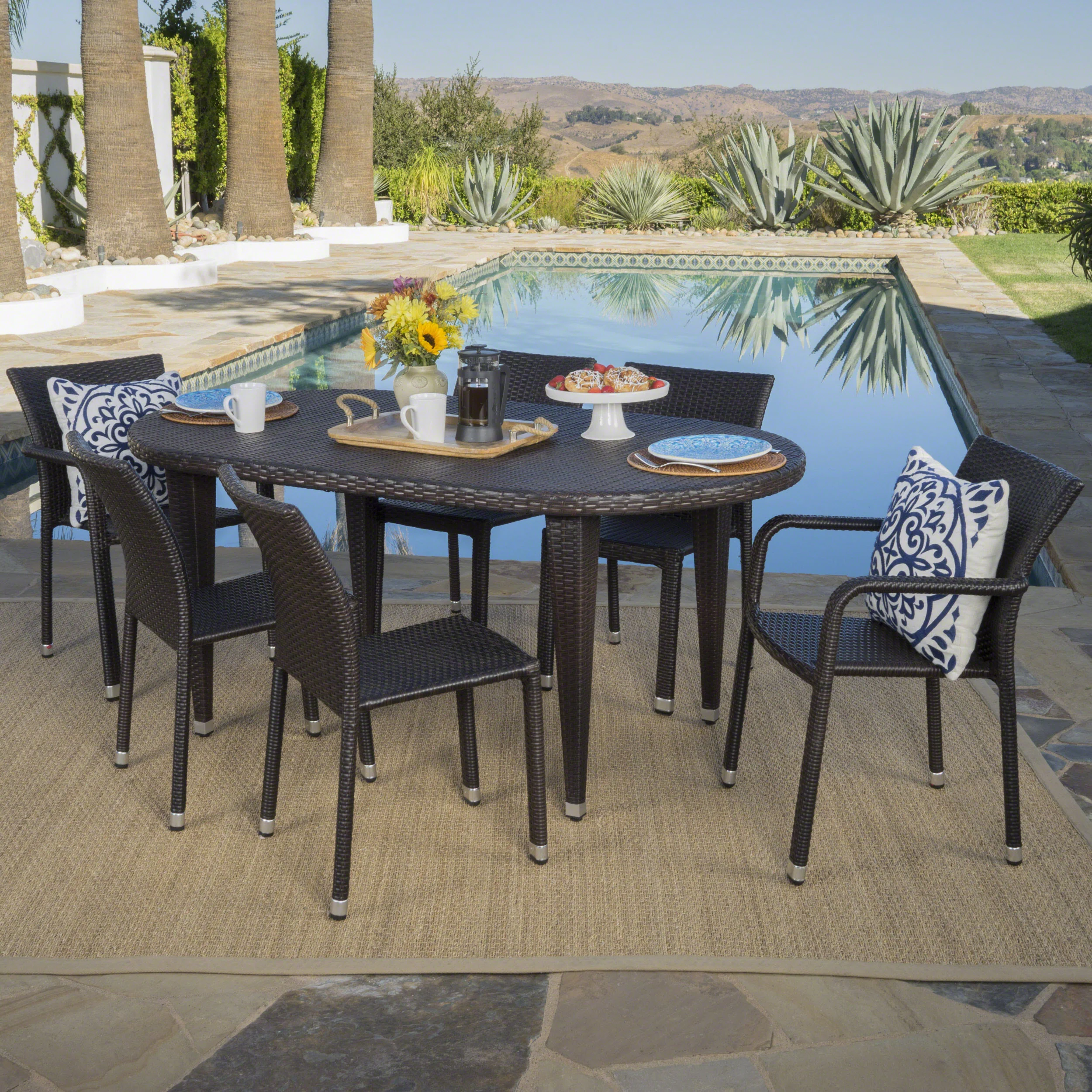 Evanch Outdoor 7 Piece Multi-brown Wicker Oval Dining Set with Stacking Chairs - furnishings