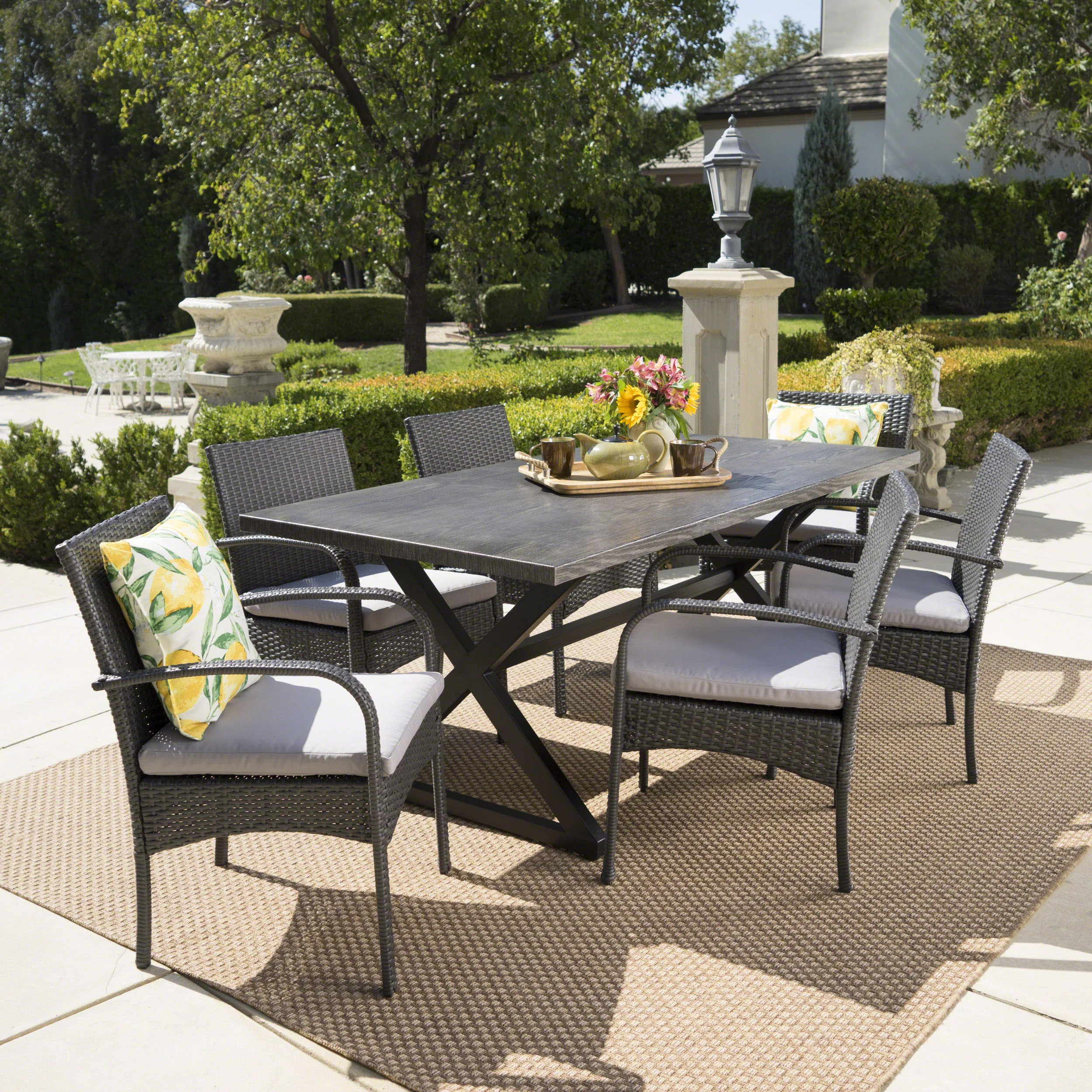 Ashley Outdoor 7 Piece Aluminum Dining Set with Wicker Dining Chairs - furnishings