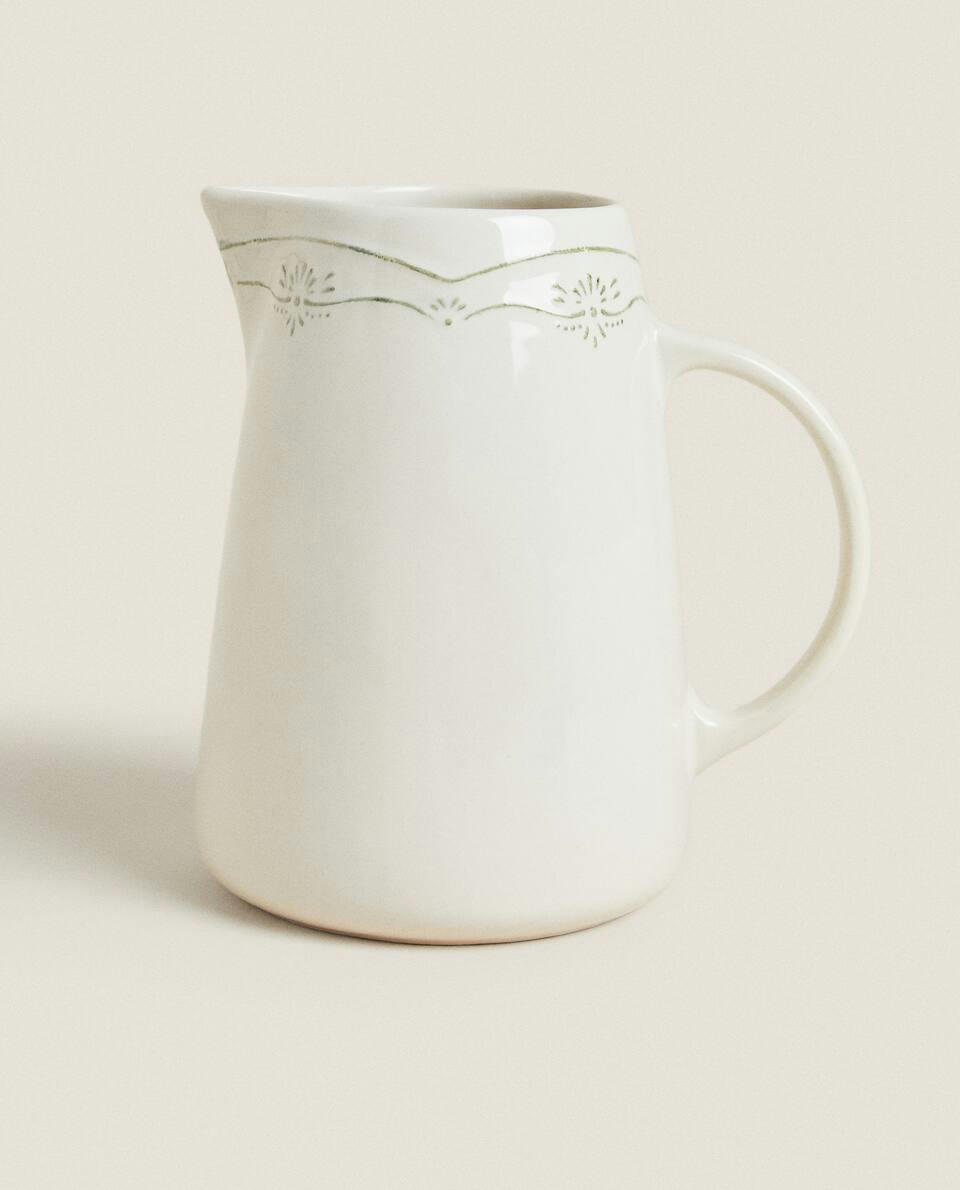 EARTHENWARE JUG WITH RAISED CHRISTMAS DESIGN