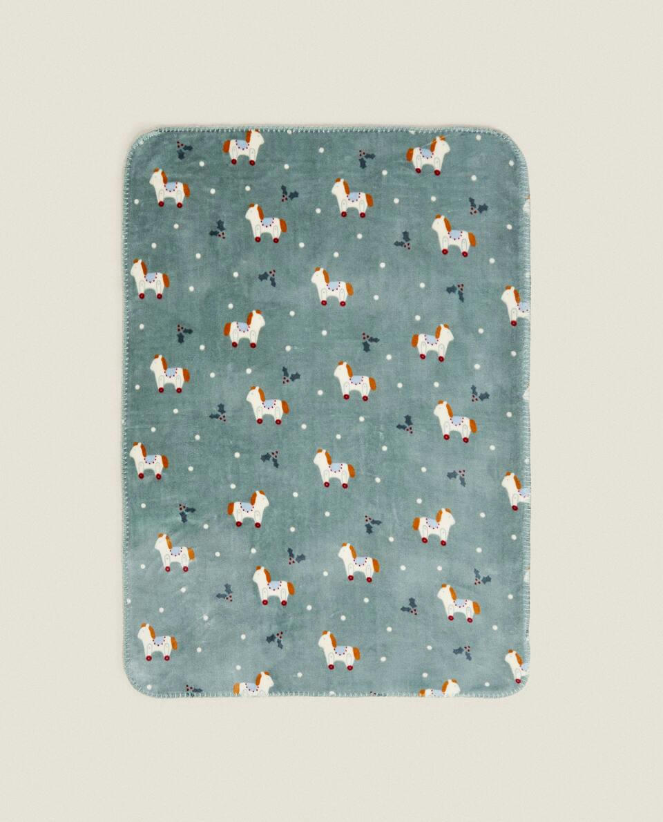 CHILDREN’S FLEECE BLANKET WITH CHRISTMAS ROCKING HORSE